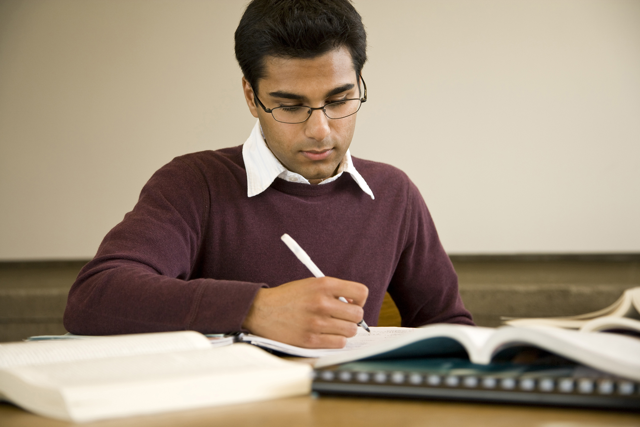 student writing in book