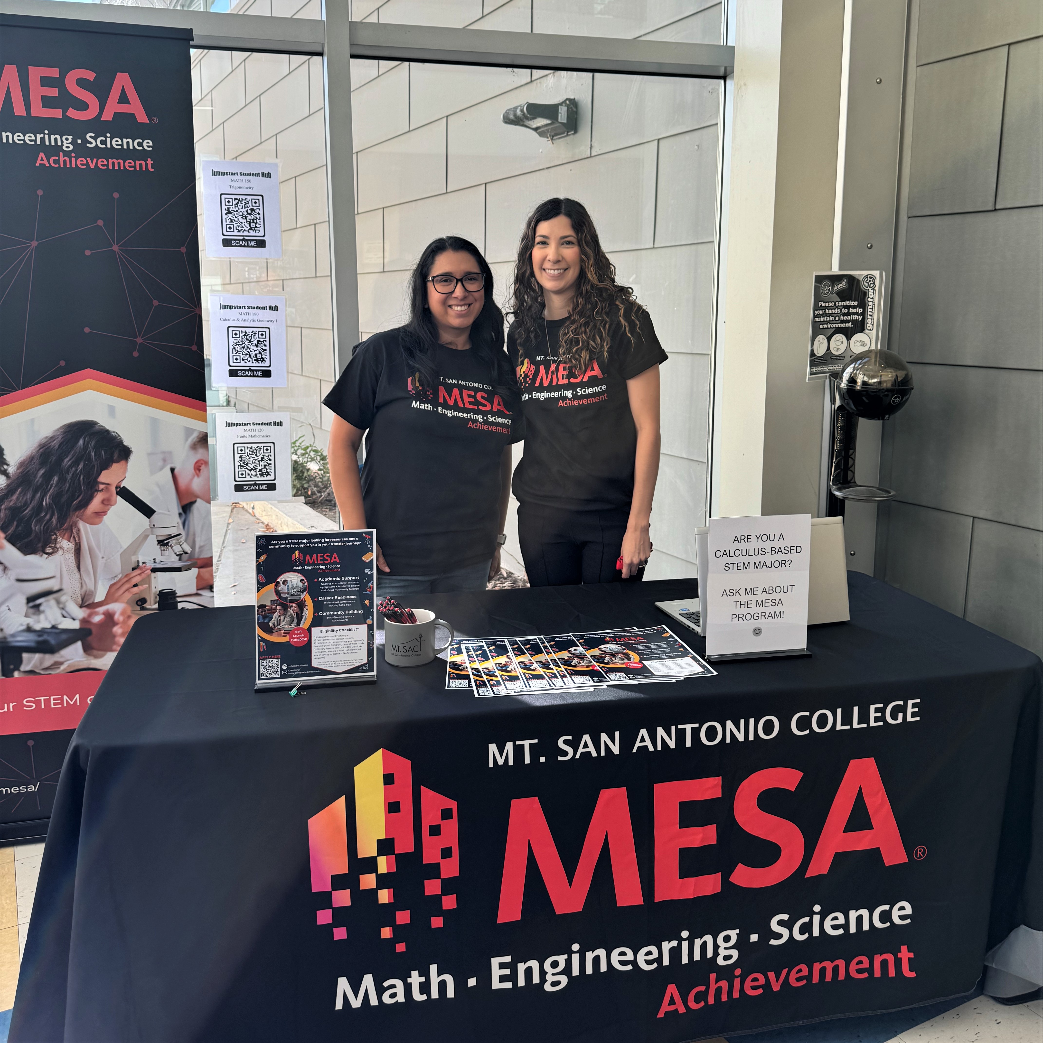 Staff standing in behind MESA table