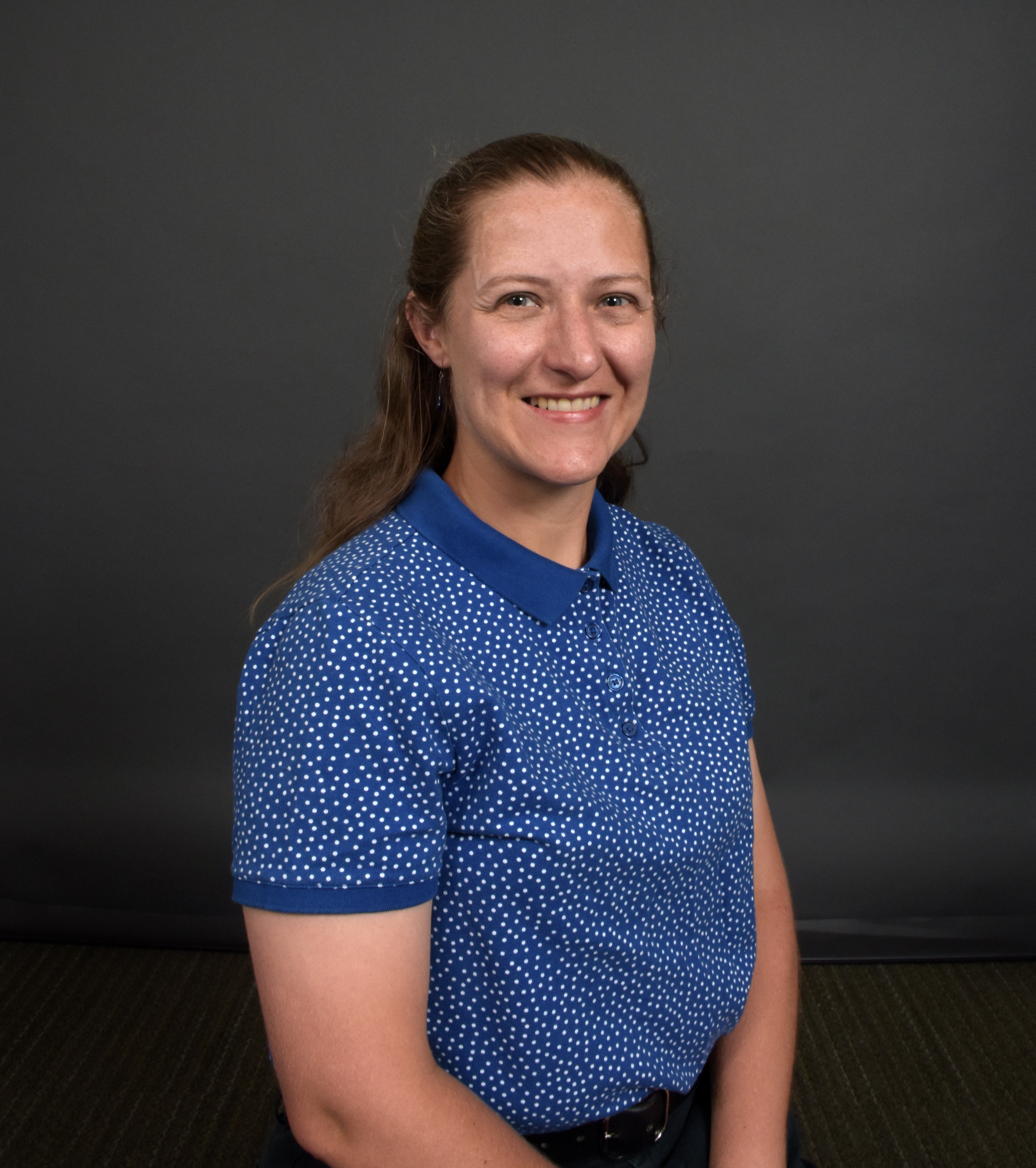 Prof. Sarah Nichols wearing a blue shirt