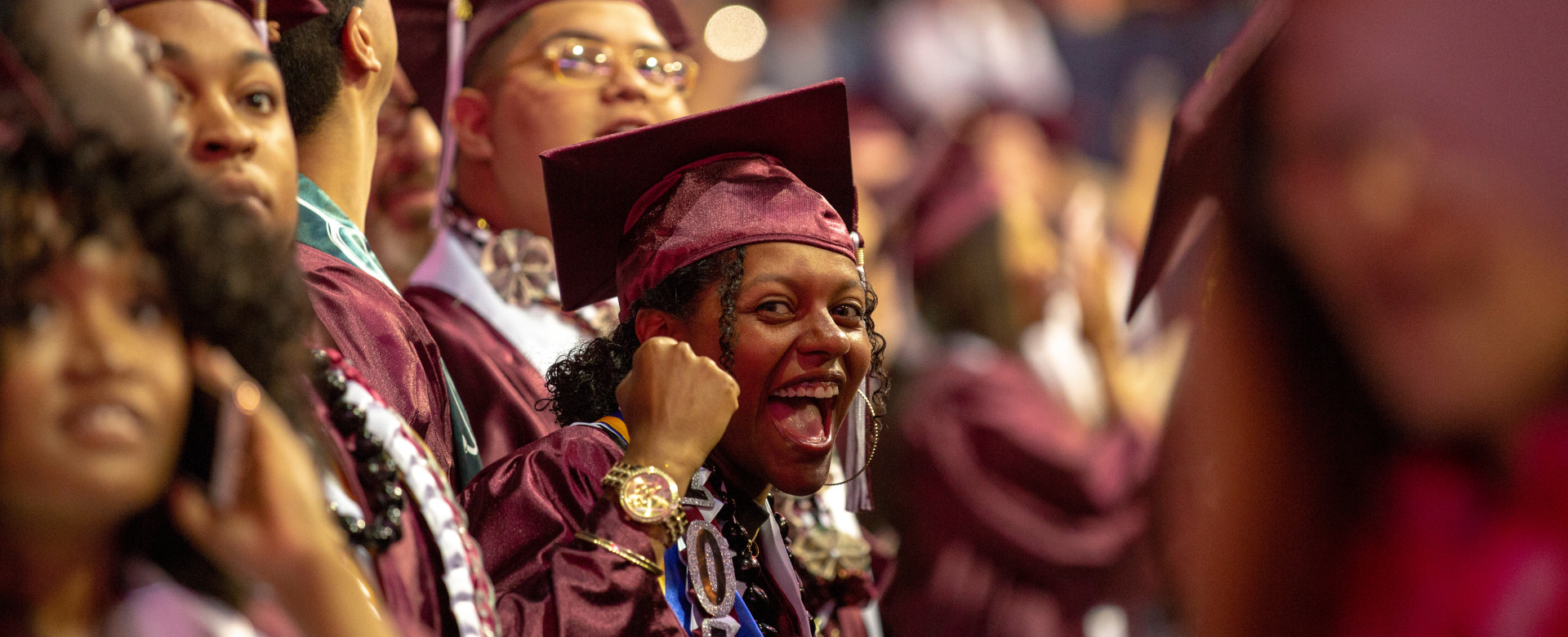 Excited grad with a fist pump