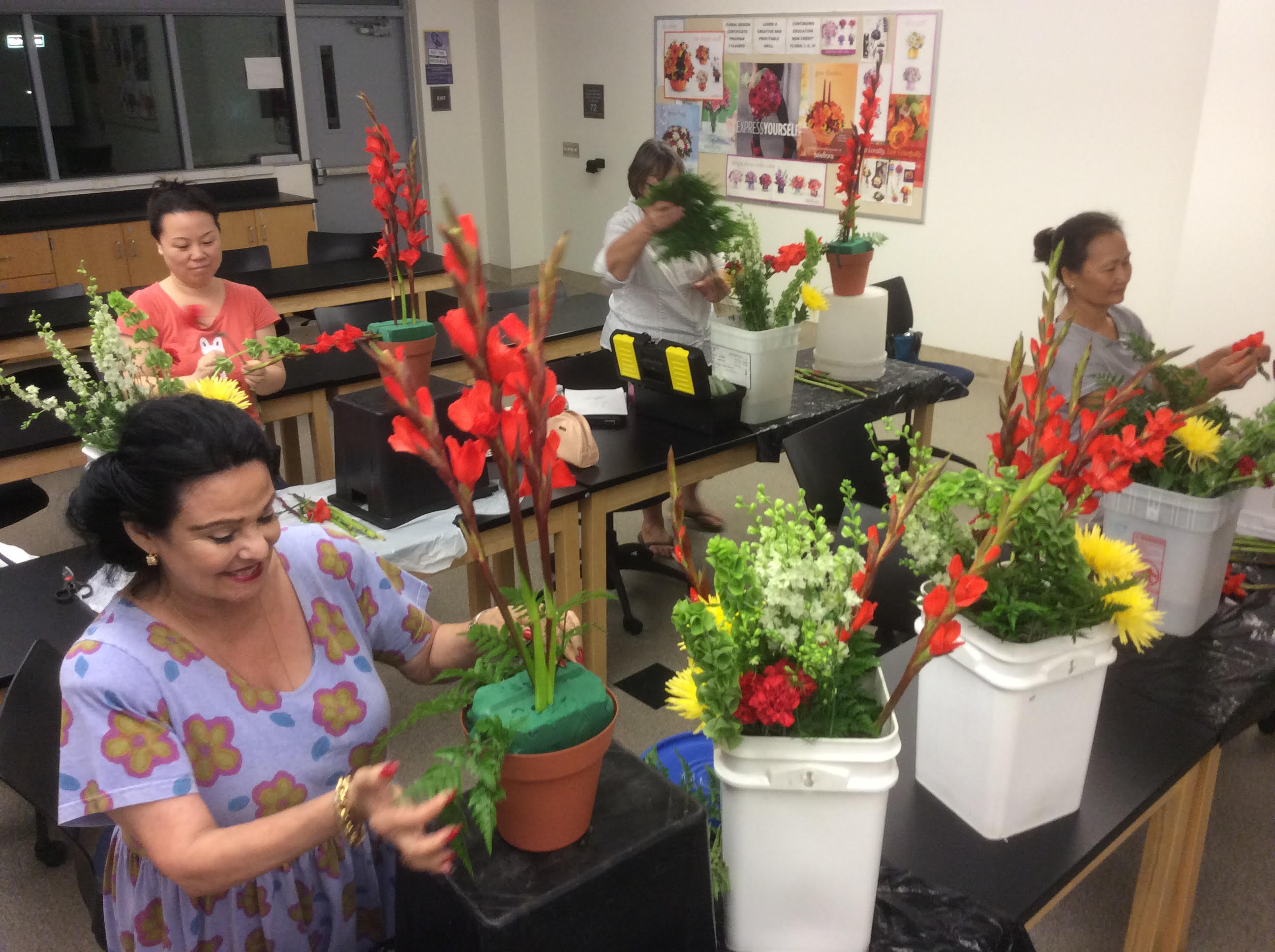 Students creating floral arrangements 