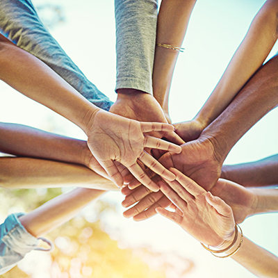 hands together in a huddle